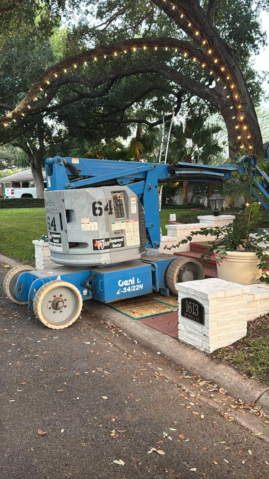 Boom lift at a residential Christmas light installation